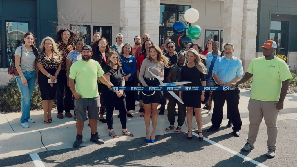 Residences of Siena South team and representatives of the Round Rock Chamber of Commerce cutting ribbon at the grand opening celebration